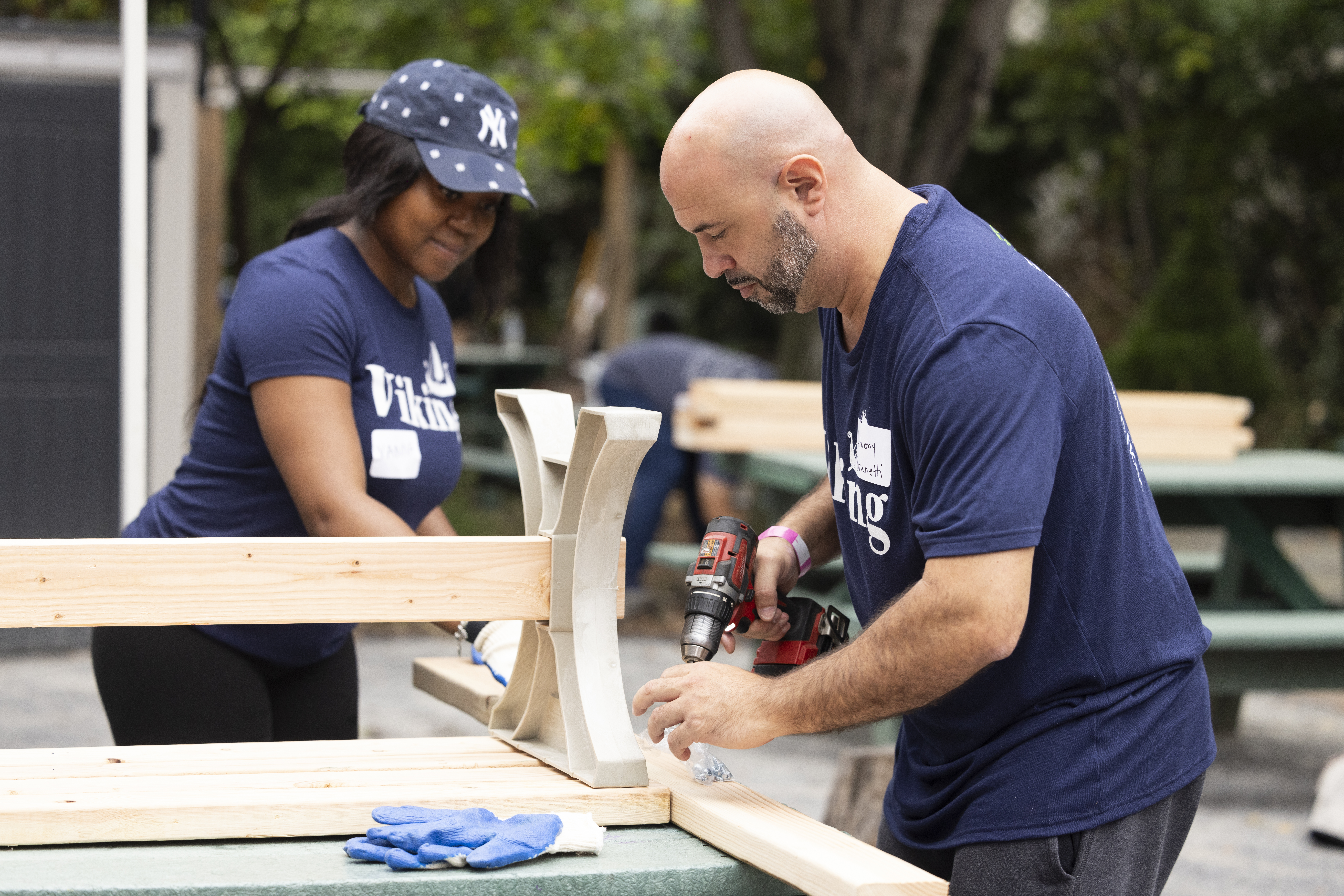 A yard with freshly constructed planter boxes for vegetables shows what the lot looked like after Vikings got involved as part of Service Day.