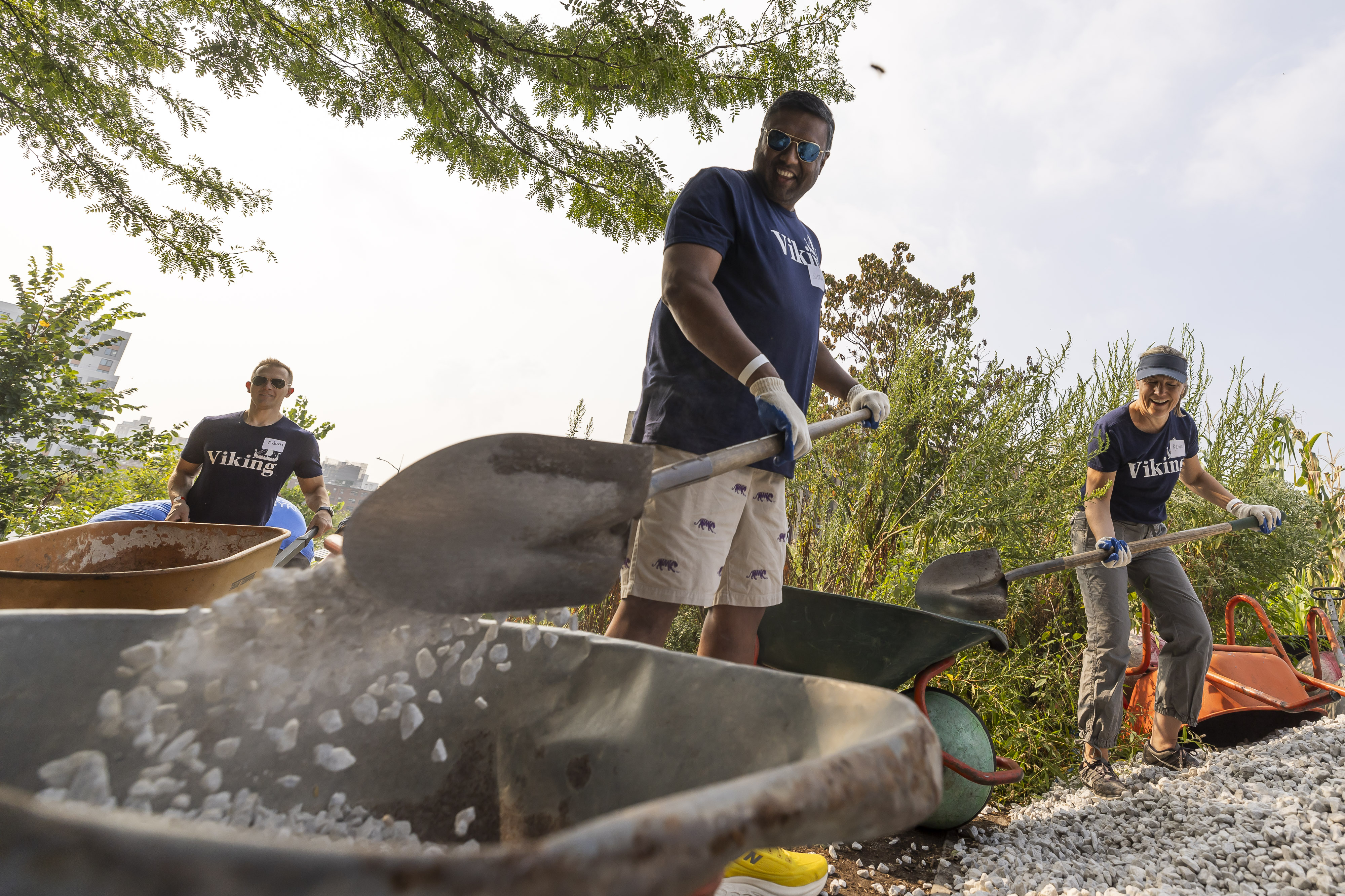 A yard with freshly constructed planter boxes for vegetables shows what the lot looked like after Vikings got involved as part of Service Day.