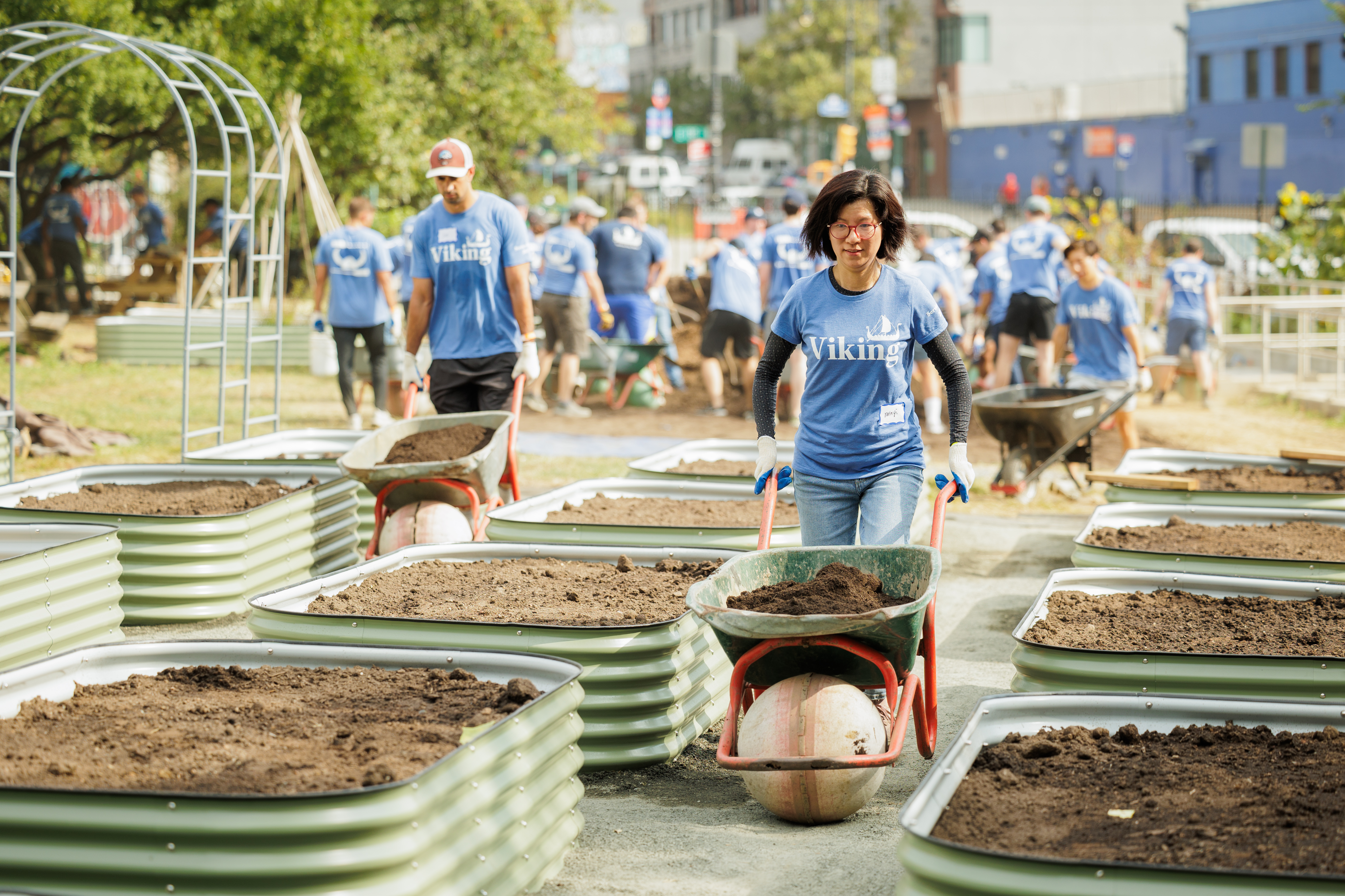 Viking Service Day, La Finca Del Sur A yard with freshly constructed planter boxes for vegetables shows what the lot looked like after Vikings got involved as part of Service Day.