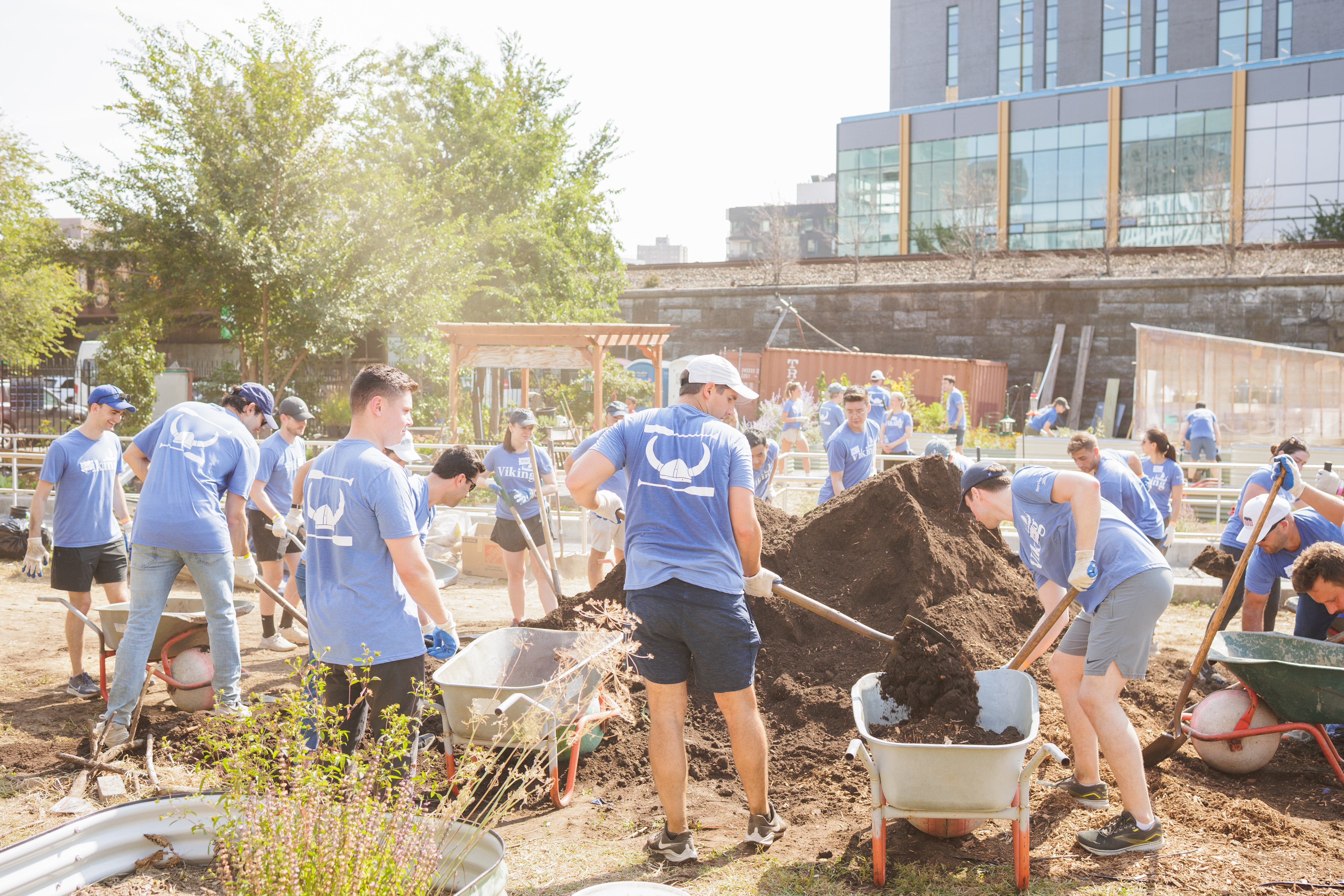 Viking Service Day, La Finca Del Sur A yard with freshly constructed planter boxes for vegetables shows what the lot looked like after Vikings got involved as part of Service Day.
